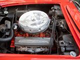 a red car with an engine in it ' s trunk