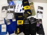 many pairs of socks that are sitting on a table