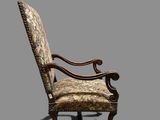 an old fashioned chair with a floral upholstered seat
