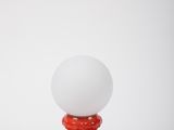 pair of red and white table lamps on a white background