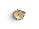 a gold plated sunflower charm with a black eye