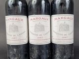 three bottles of wine sitting next to each other on a table