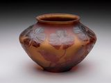 a vase that is sitting on a white surface