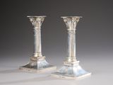 pair of antique silver candlesticks with blue and white designs
