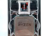 an amd ryzenn processor in its packaging on a white surface