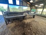 a large pile of dirt on the floor of a barn