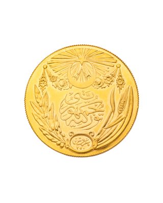 l'image d'une pièce d'or sur laquelle figurent des armoiries