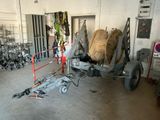 a trailer with a bunch of bags on the back of it