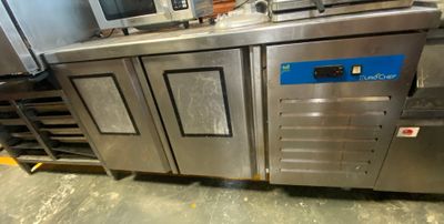 a kitchen with a bunch of stainless steel appliances in it