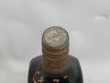 a bottle of liquor that is sitting on top of a table