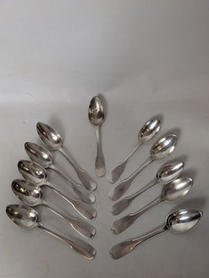 a lot of spoons arranged in a circle on the table