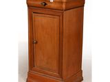 a small wooden cabinet with a drawer on top of it