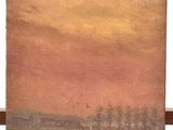 an oil painting of a landscape on a easel with a sunset in the background