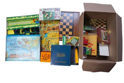 a cardboard box filled with books and other items