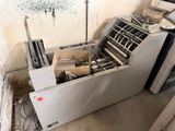 a machine that is sitting in the corner of a room