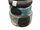 four tires stacked on top of each other on a white background