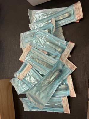 a pile of blue packets sitting on top of a table