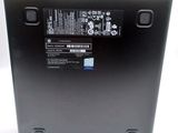 the back of a laptop with a battery on top of it