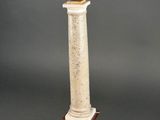 an image of a statue of a man on top of a column