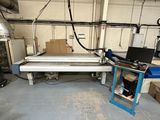 an image of a factory with a large machine in the middle of the room