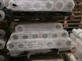 several rolls of plastic are stacked on top of each other in a warehouse