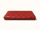 a red leather wallet with a zipper on the front