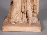 a statue of a woman holding a baby in her arms