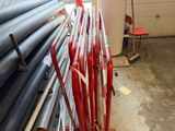 a lot of pipes that are stacked up in a room