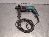 a corded drill with a cord attached to it on a table