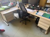 a desk with two monitors and a keyboard on it