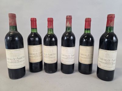 six bottles of wine are lined up on a table