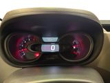a car dashboard with a digital gauge and speedometer