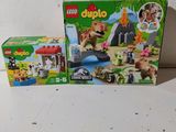 two lego duplo sets are sitting on a white surface
