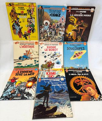several books are stacked on top of each other on a white surface