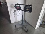 a camera on a tripod next to a video camera