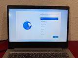 a laptop that is sitting on a table with a mouse