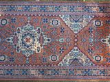 an old rug is laying on the ground in the grass