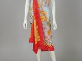a mannequin wearing a red and yellow dress with a floral print
