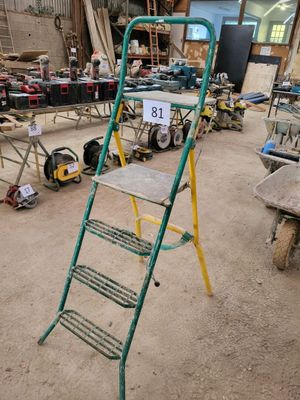 a ladder that is sitting in the middle of a room