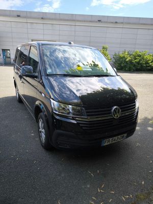 a black van that is parked in a parking lot
