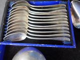 many spoons and spoon spoons in a blue box