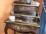 a small table with a vase on top of it