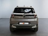the rear view of a silver mercedes suv parked in a garage