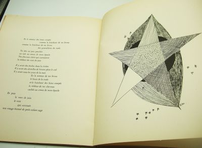 an open book with a drawing of a star on it