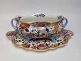 a bowl and saucer on a saucer on a plate