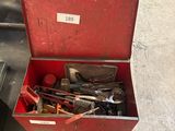 a red tool box with tools in it on the floor