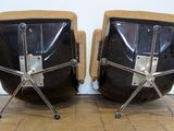 two chairs that are sitting next to each other on the floor