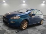 a picture of a blue car parked in a garage