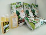 many bags of food sitting on a shelf next to a bottle of liquid