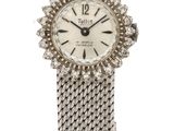 a close up of a watch on a white background with a white background